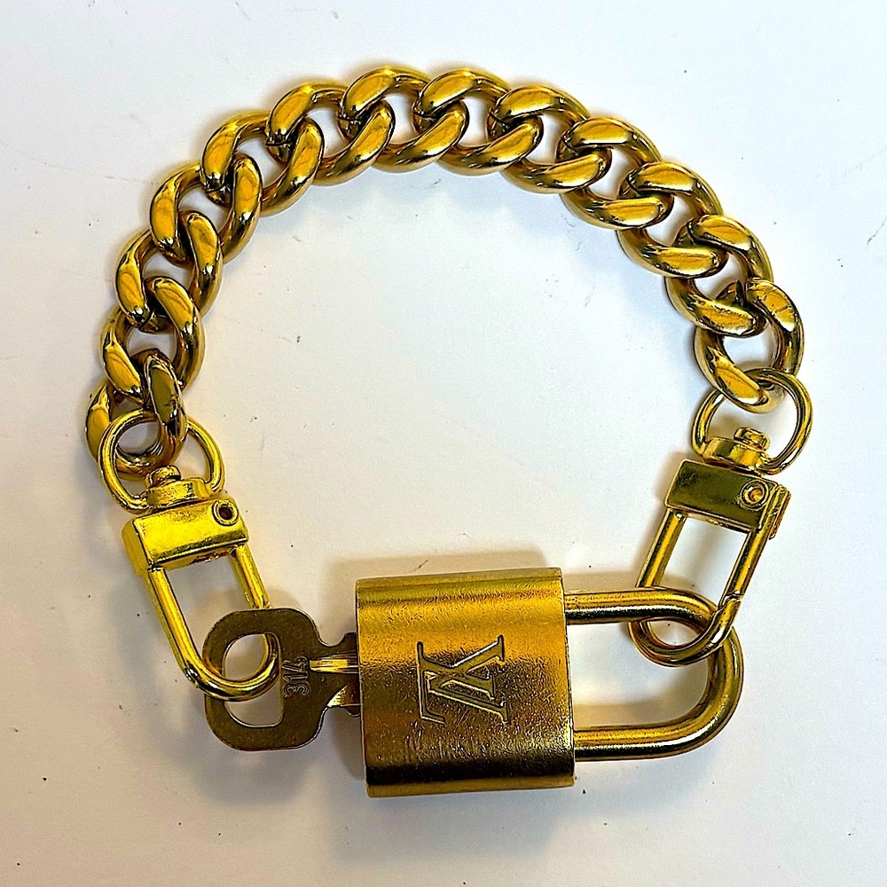 Authentic Louis Vuitton padlock and key bracelet comes complementary